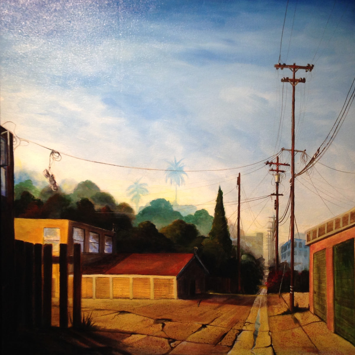 Golden Garages detail – warm light on cracked pavement and garage facades